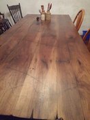 Image of a solid walnut dining room table