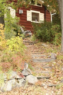 Image of stone steps leading to a cottage 